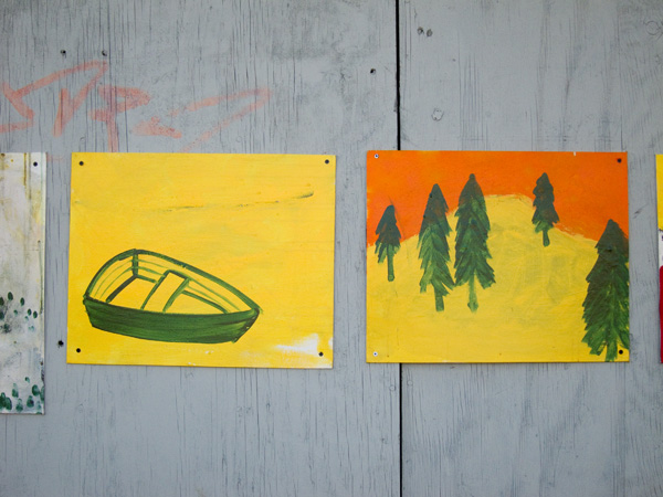 yellow green paintings, painting of boat, painting of trees, guerilla art