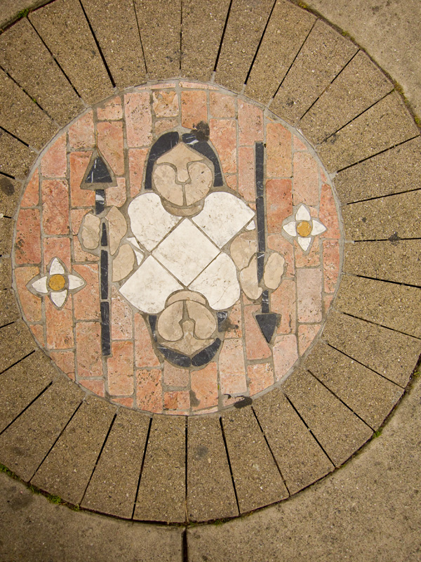 woman with spear, stone mosaics, fruitvale transit village art